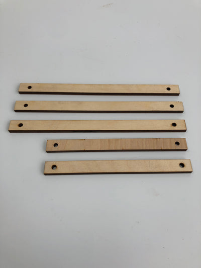 Birch wooden, lasercut sticks with two holes. In two sizes. Perfect to hang your work!